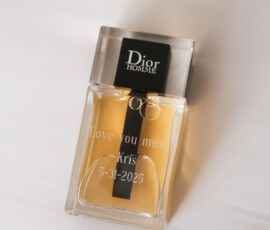Dior Homme bottle engraved with “Love you most, Kris, 5-31-2025” on a white surface—ideal for New Orleans weddings.