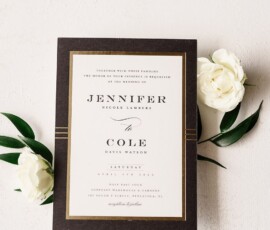 Elegant wedding invitation with black border, gold accents, white roses, green leaves; announces Jennifer and Cole’s marriage.