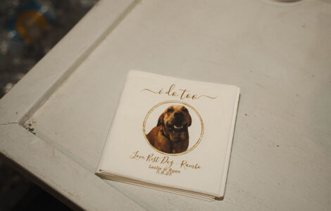 White napkins featuring a dog photo, “I do too” text, Leslie & Ryan’s names, 3.8.25 date, and “Love Best Day—Ruuko.”.