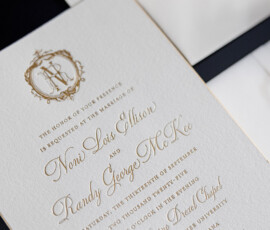Gold monogram wedding invite for Nomi Lois Allison and Randy George McKee at Saint Katherine Drexel Chapel, New Orleans.